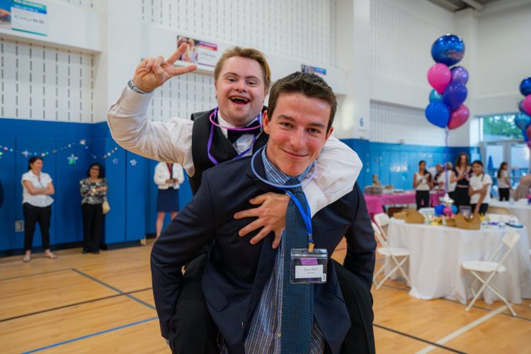 A piggy back ride at the extra special prom hosted by the Summit Area YMCA.