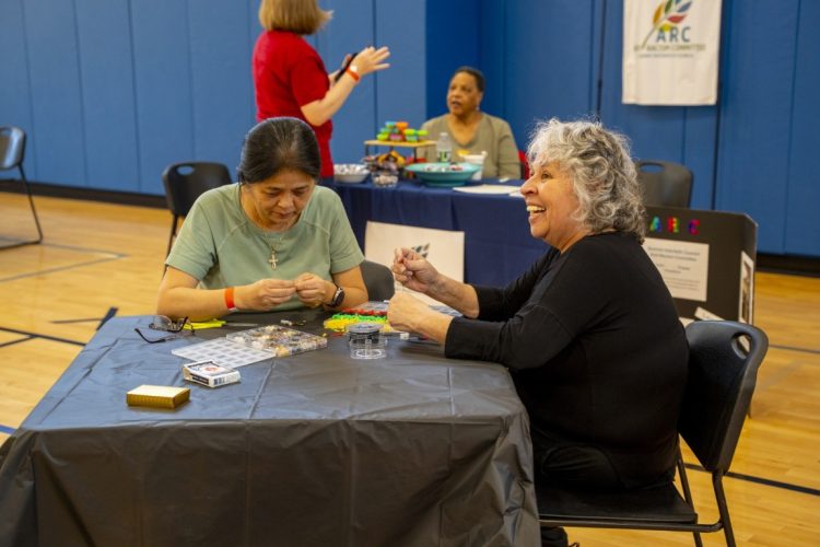 two women beading