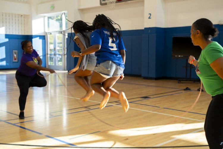 Children playing double dutch at juneteenth event