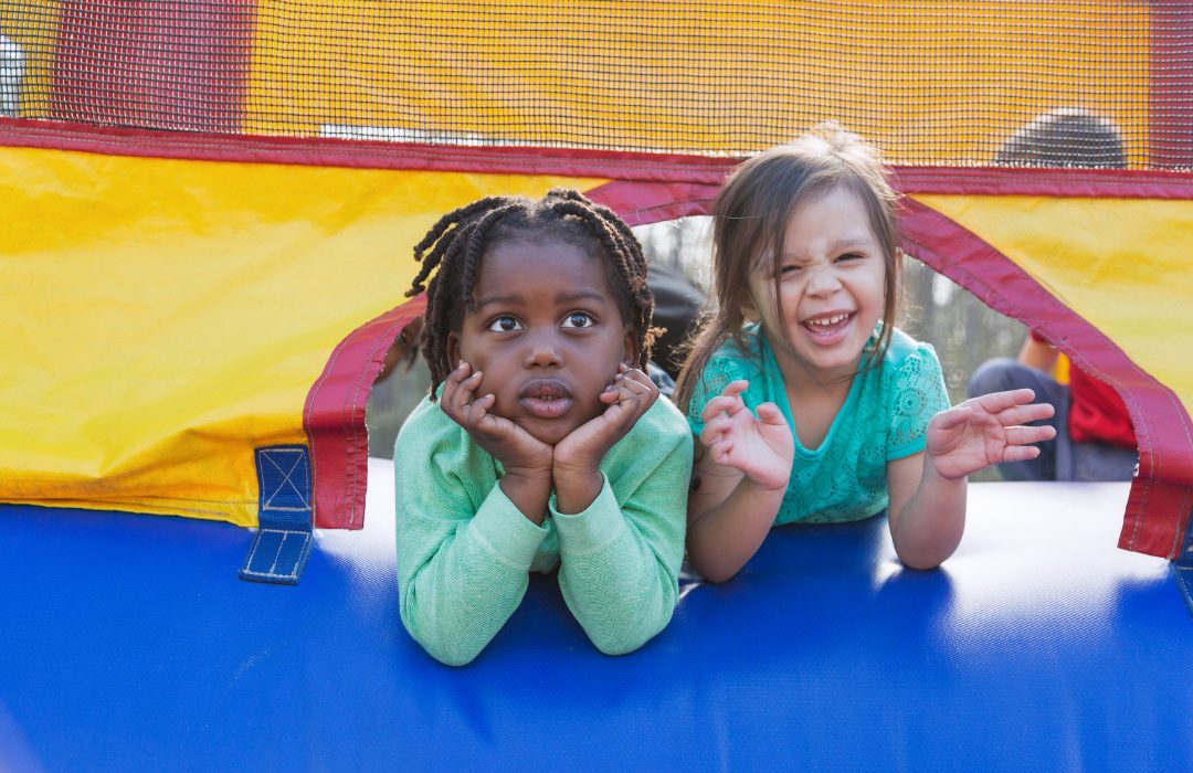 two children in a bounce house