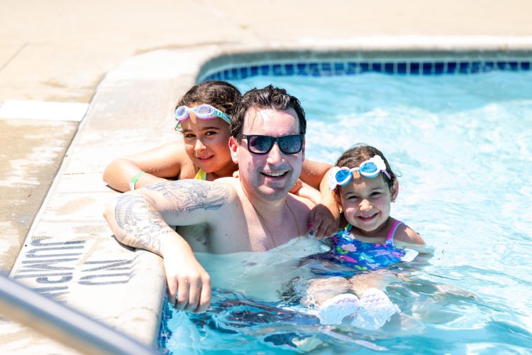Father and two children enjoying family time Springfield YMCA Community Pool