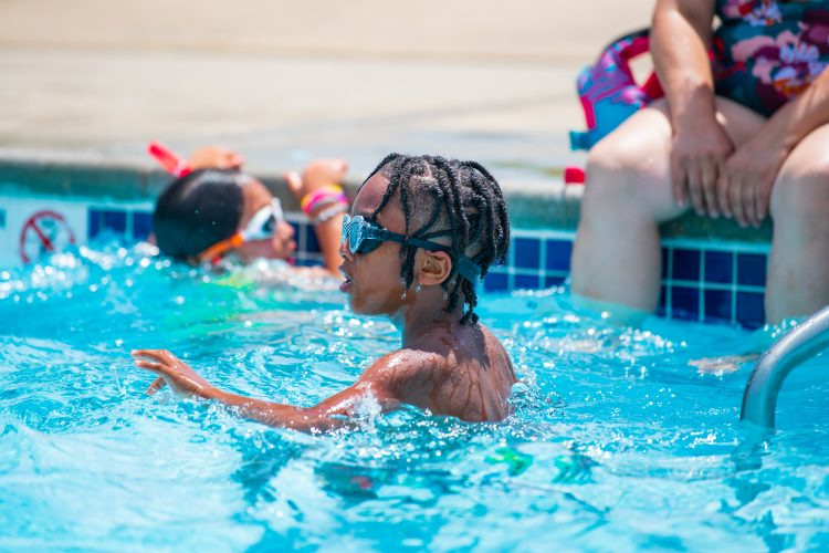 Young boy swimming in the Springfield YMCA Community Pool