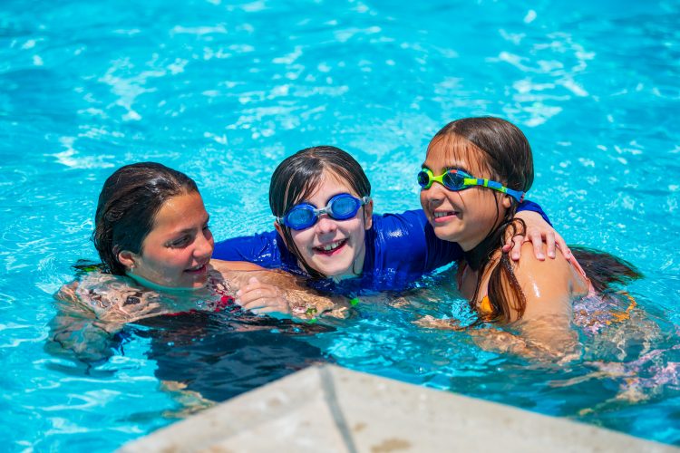 Girls in Pool smiling at Berkeley Heights COmmunity Pool