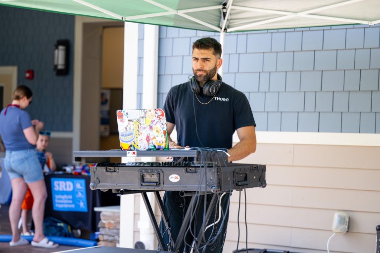 DJ at Springfield community pool pride event