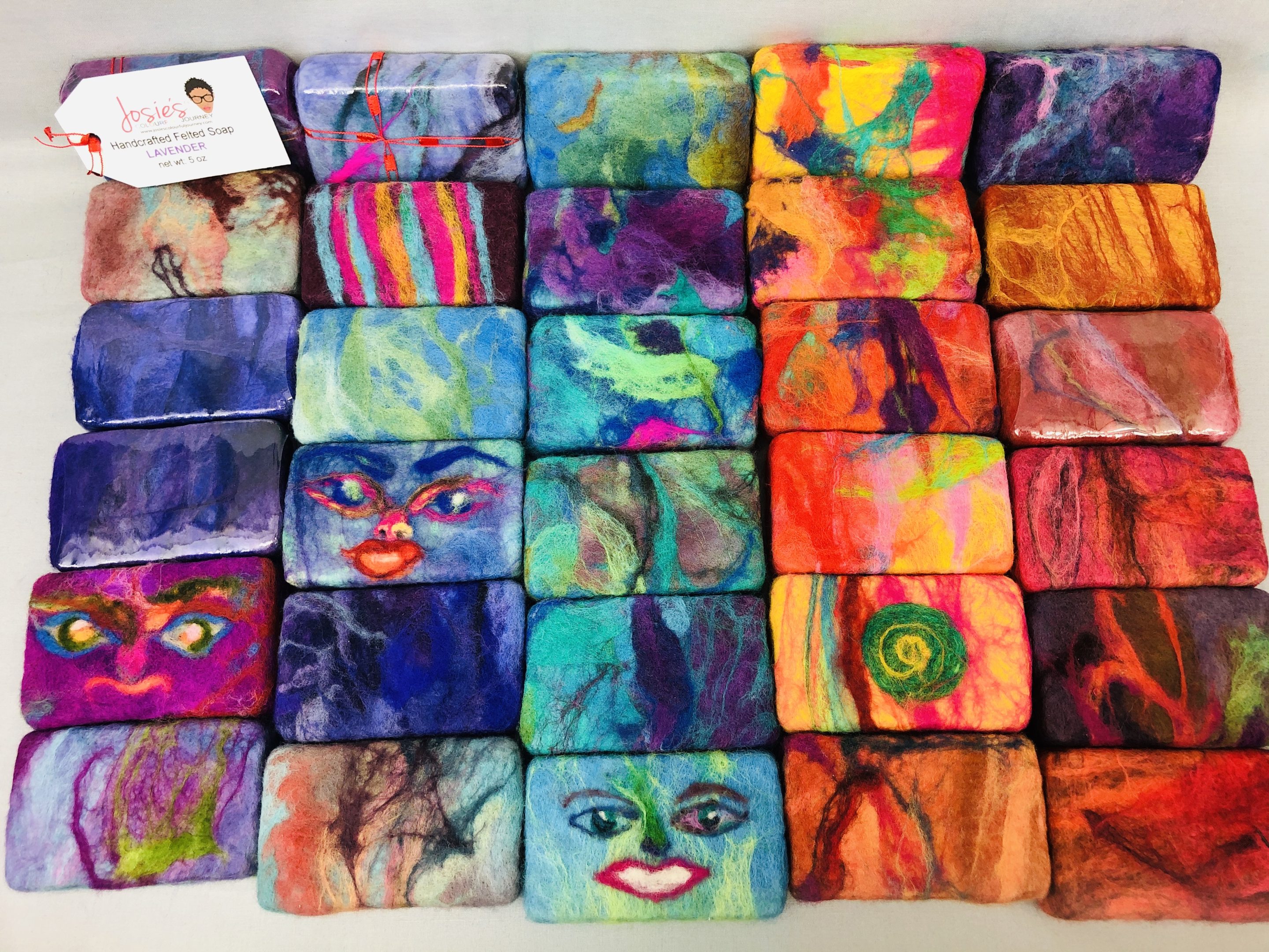 Felt-covered soap and fiber art made by families