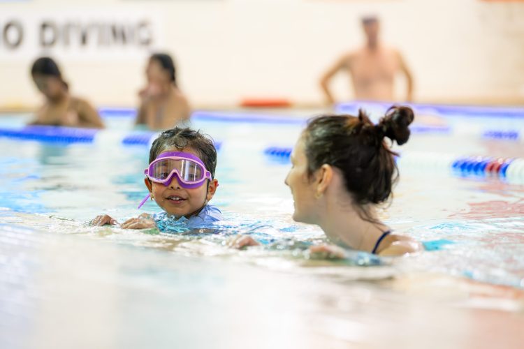 CHILD TAKING A SWIM LESSON AT SUMMIT AREA YMCA