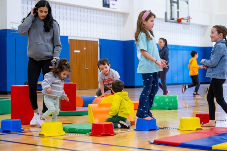 kids playing on obstacle course