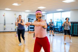 woman in pink in exercise class