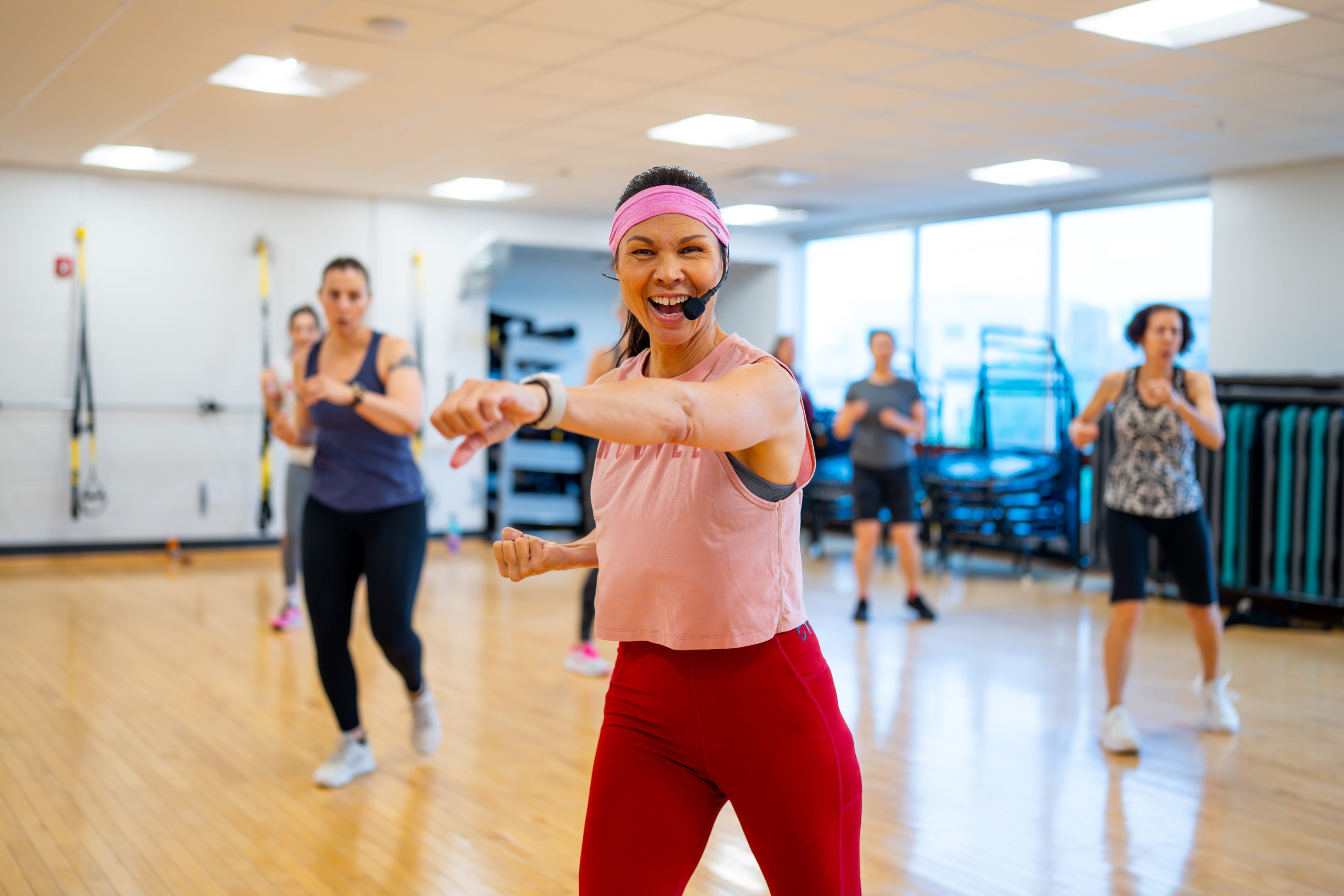woman in pink in exercise class